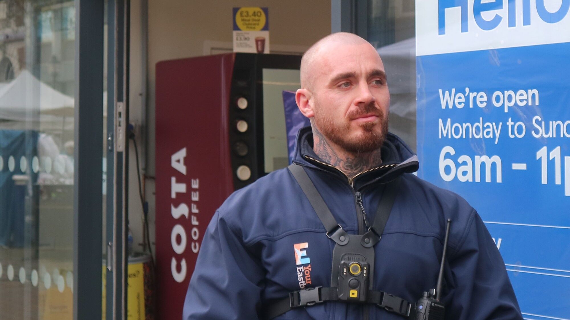 A Your Eastbourne security officer wearing a body camera outside a town centre shop
